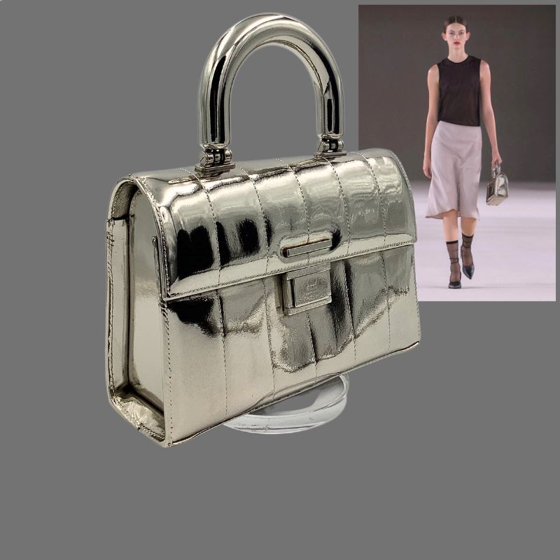 Ami handbag silver plated as luxury product merchandising display-fashion show