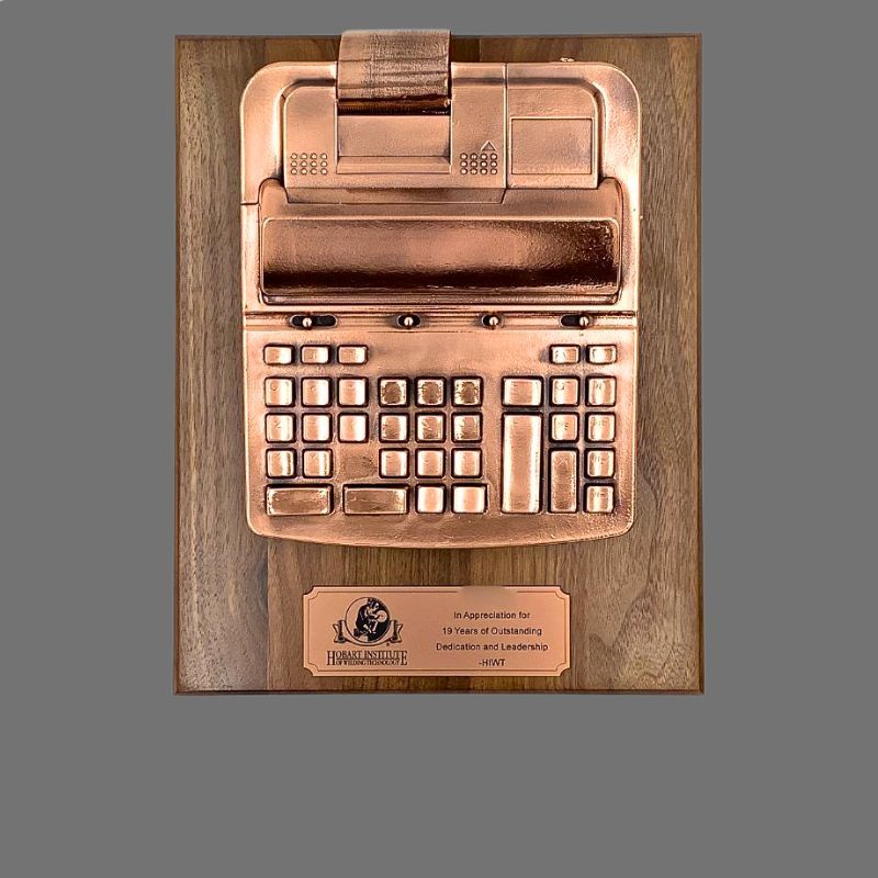 Texas Instruments calculator bronzed into a retirement gift
